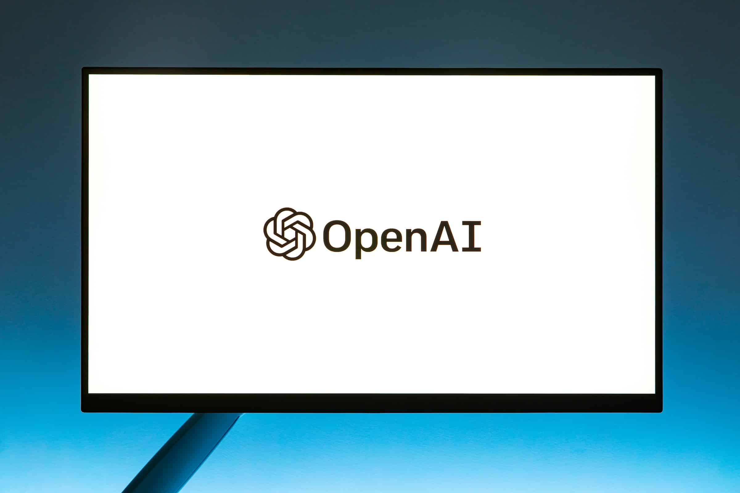 A screen with the words OpenAI