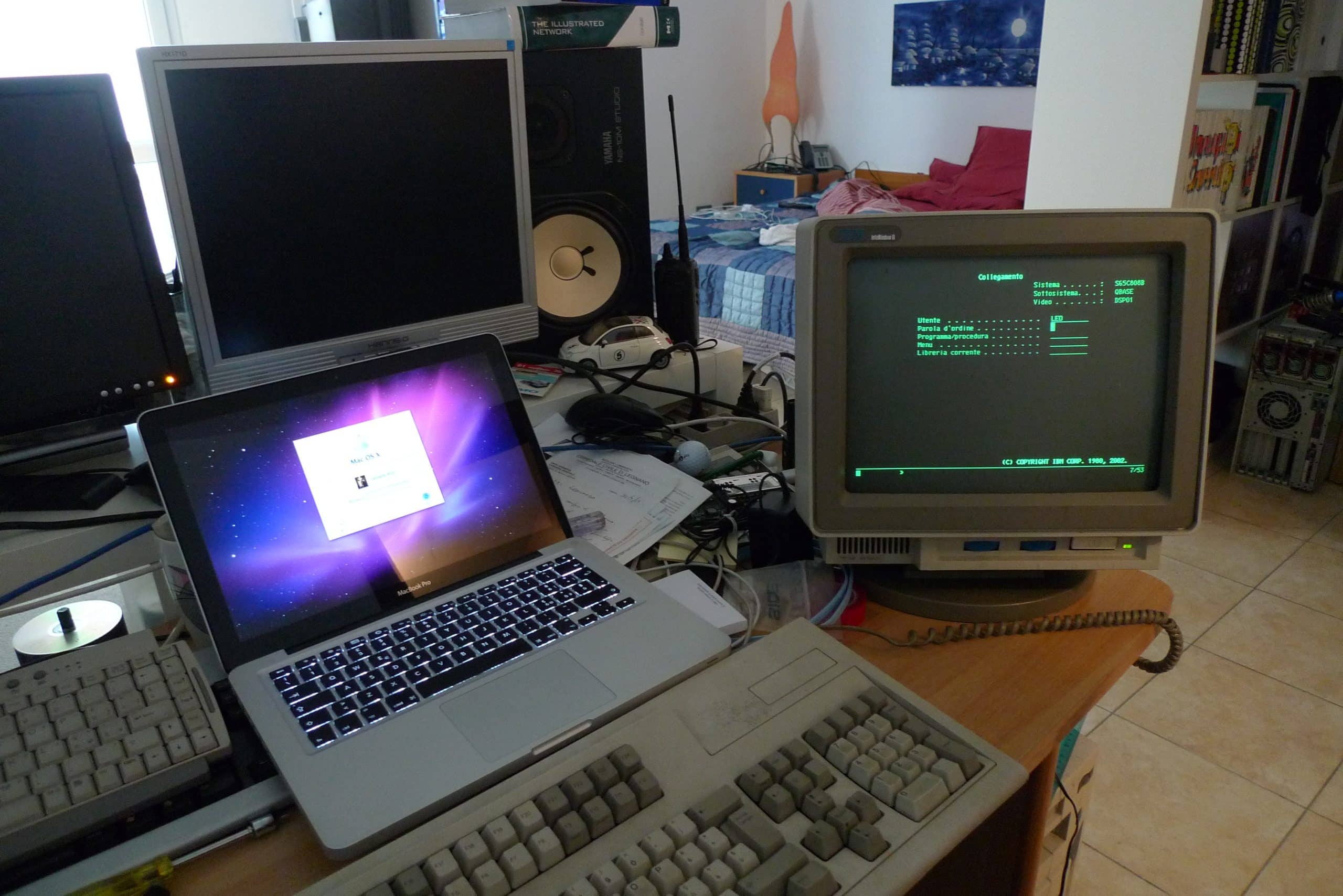 side by side comparison if 2010 Macbook compoared to a green and black login AS/400